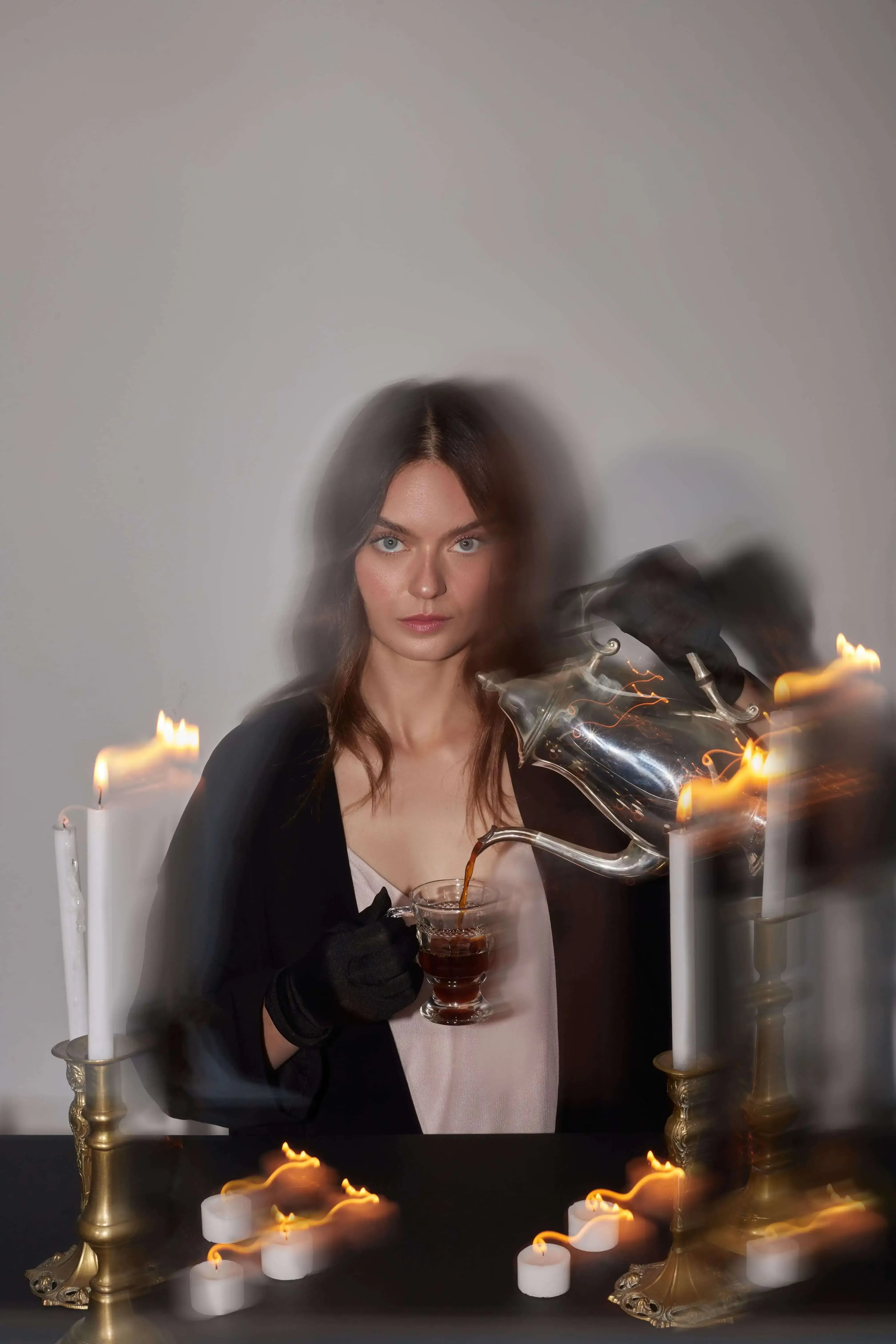 woman pouring a cup of coffee.